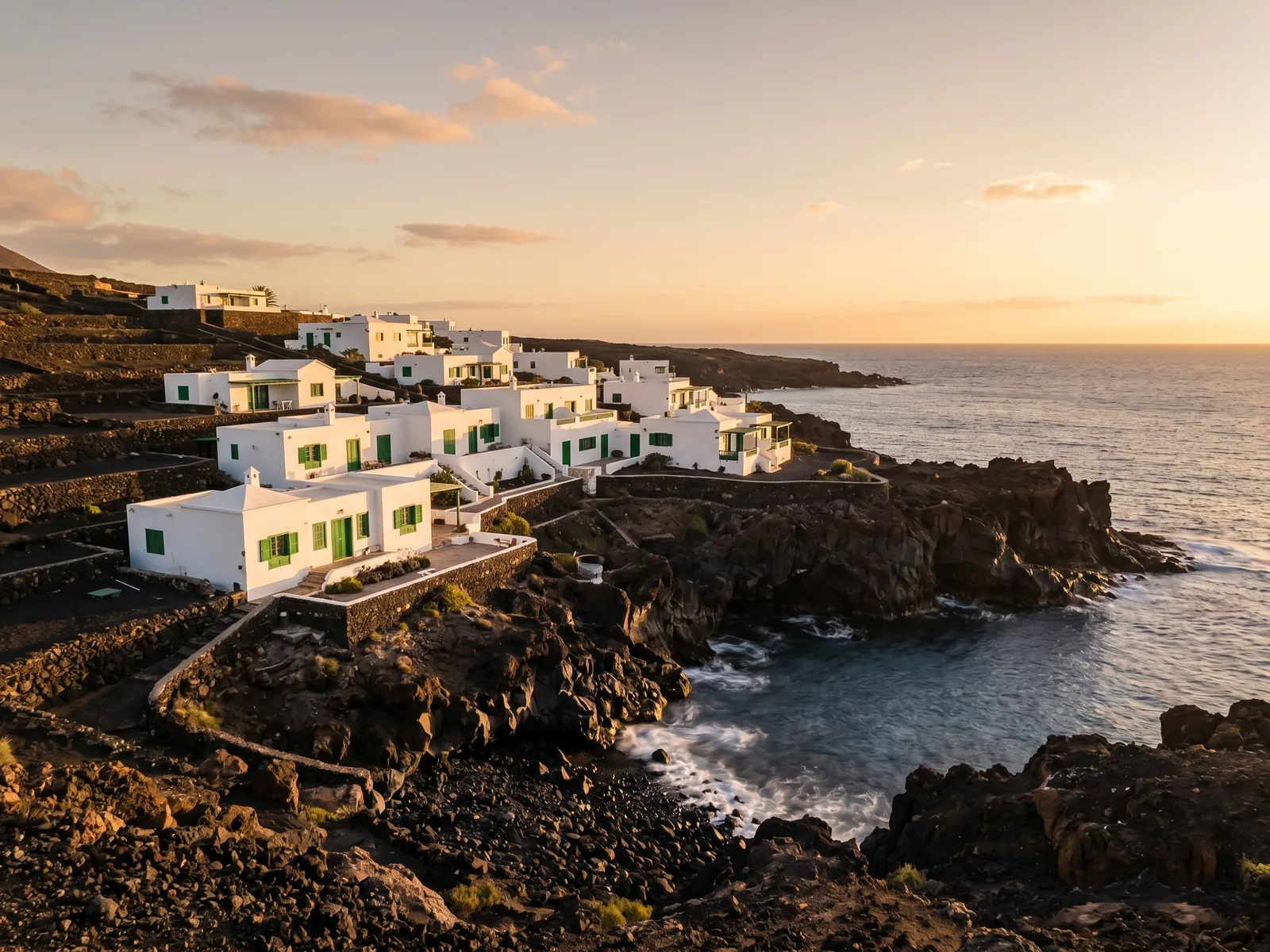 Whitewashed terrace overlooking the volcanic Lanzarote coastline